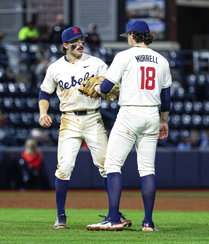 Ole Miss third baseman Andrew Fischer and relief pitcher Mitch Murrell on Friday night at Swayze Field.